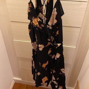 Black dress with white and yellow floral design